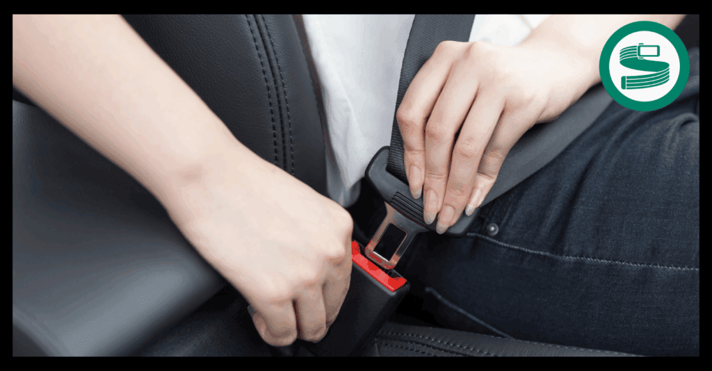 Diagram showing a seat belt extender being used in a UK car to provide extra belt length for a plus-size passenger