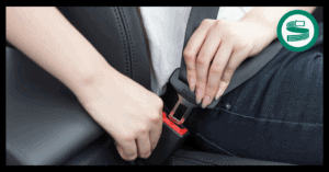 Diagram showing a seat belt extender being used in a UK car to provide extra belt length for a plus-size passenger